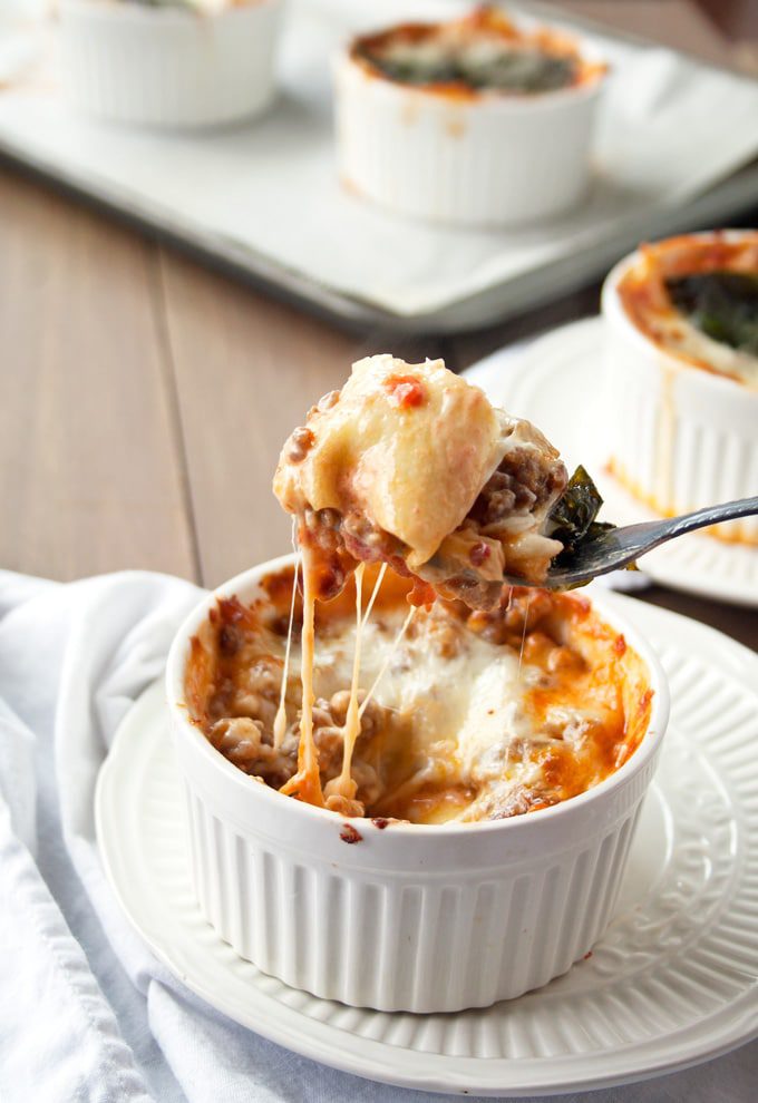 Personalized size ramekins filled with homemade pasta noodles, spicy Italian sausage, fresh-made tomato sauce and cheese – lots and lots of cheese. This is the best lasagna that you’ll ever eat!
